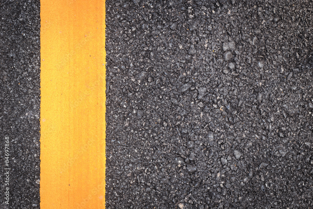 Fototapeta premium asphalt road texture with yellow stripe