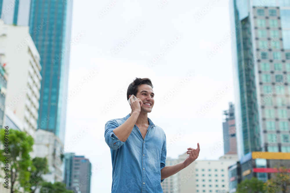 Handsome man cell phone call smile outdoor city street