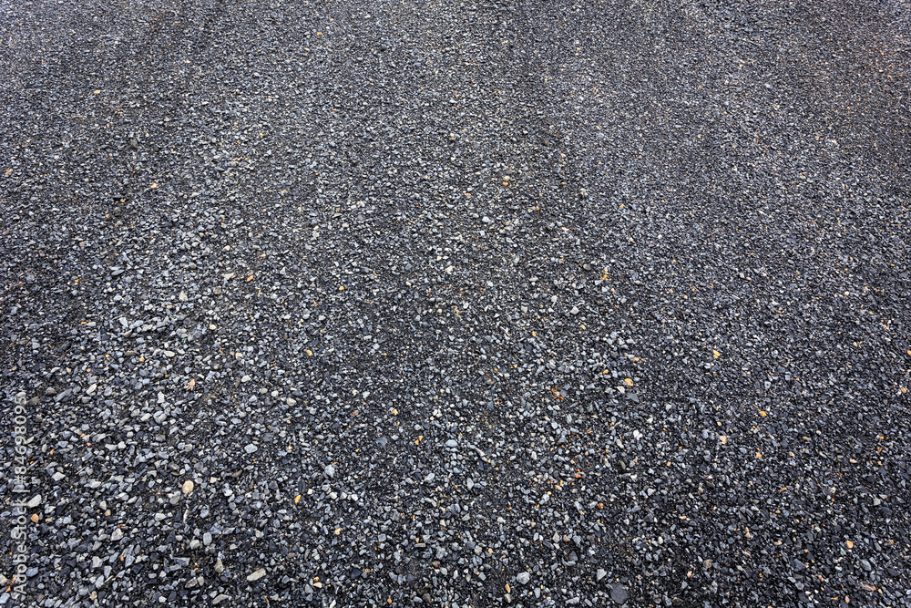 Texture black pebble stone on the road in Thailand Texture black pebble stone on the road in Thailand