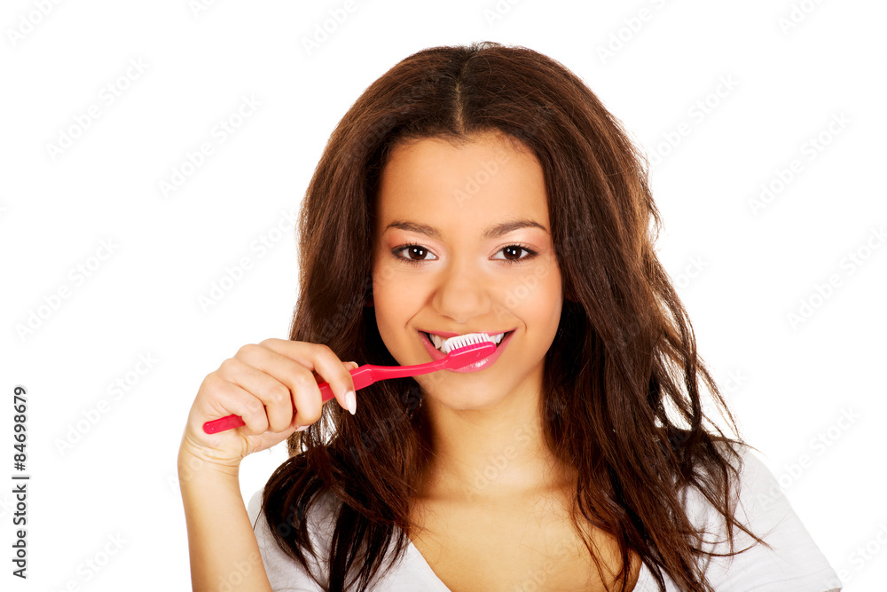 Beautiful teen brushing her teeth. Beautiful teen brushing her teeth.