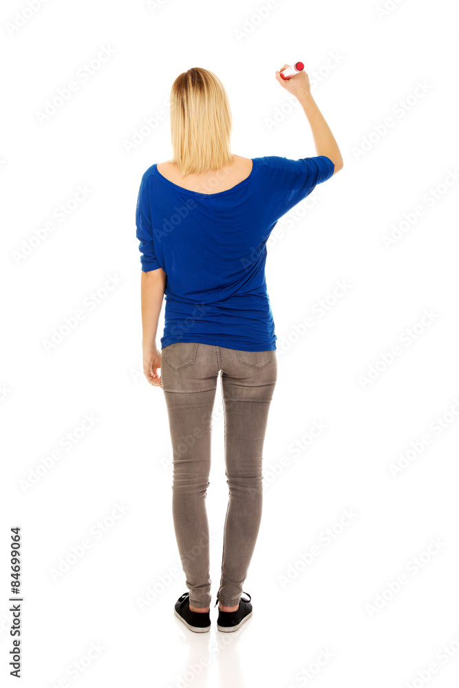Young woman writing with pencil. Young woman writing with pencil.