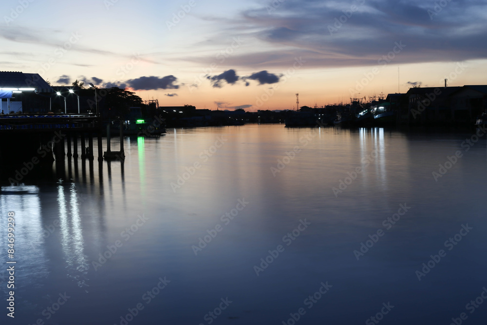 River to the Sea in Fisherman village with silhouette Sunset