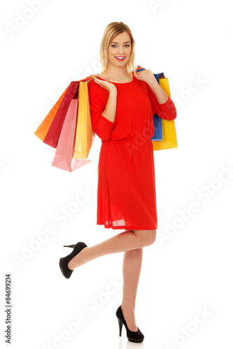 Woman with a lot of shopping bags.