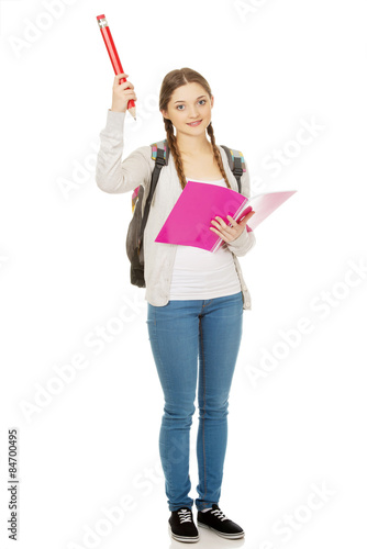 Happy student woman with big pencil.