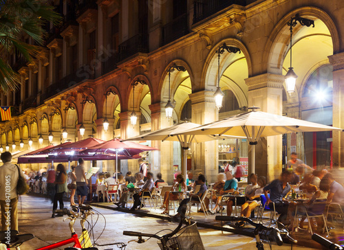 Outdoor restaurants at Placa Reial in night. Barcelona