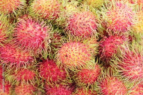 Sweet fruits rambutan in the market