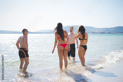 group of young multiethnic friends beach summer