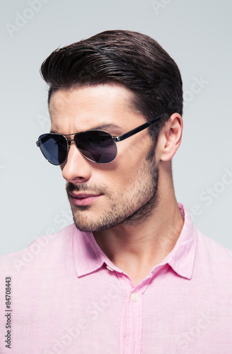 Handsome stylish man in sunglasses and shirt