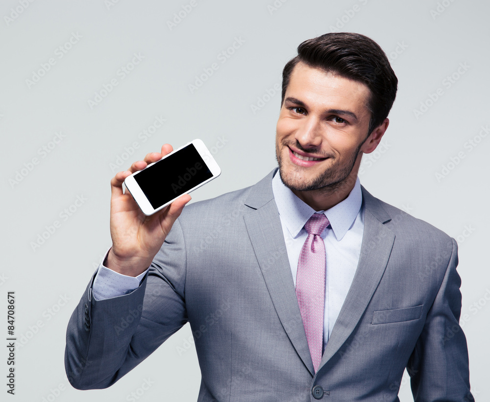 Businessman showing blank screen smartphone