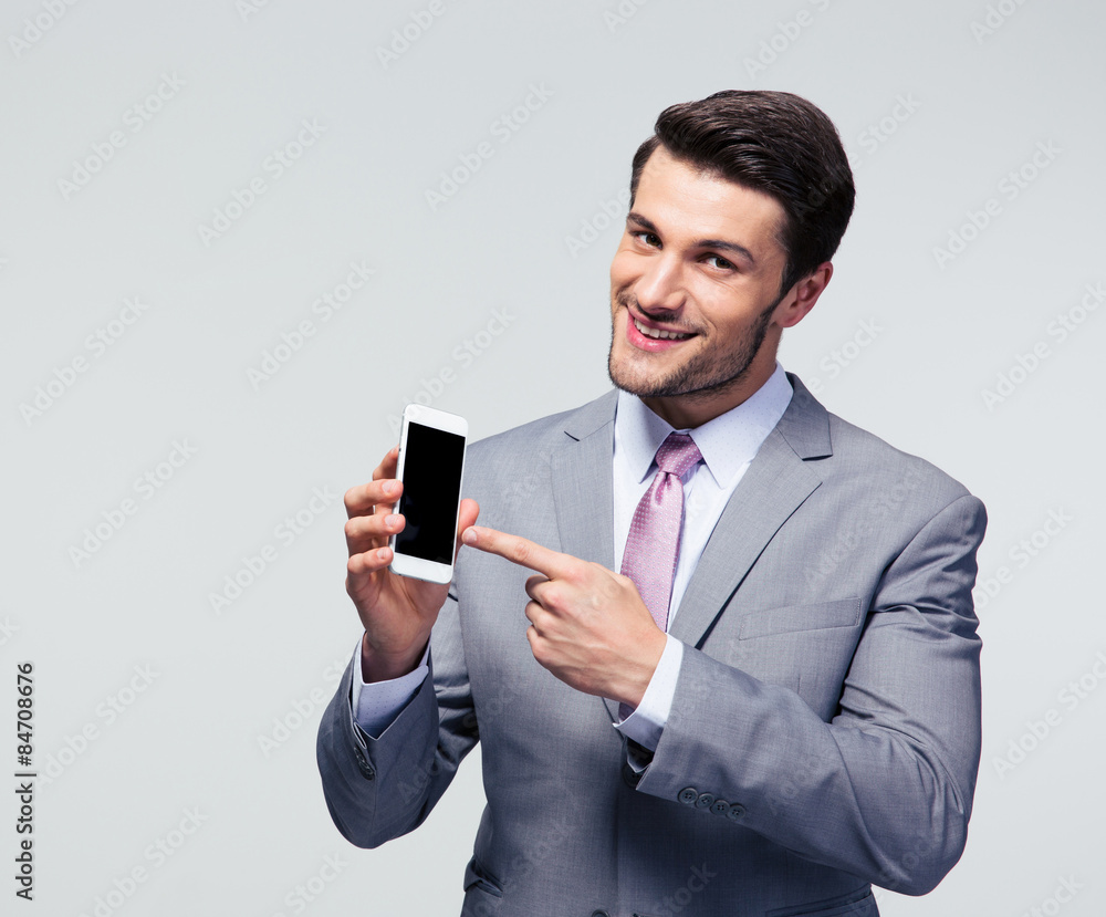 Businessman pointing finger on smartphone screen Businessman pointing finger on smartphone screen
