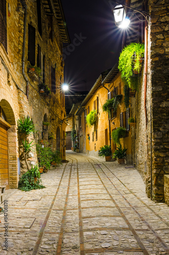 Fototapeta Naklejka Na Ścianę i Meble -  Paved alley of Spello (Umbria, Italy) in the night