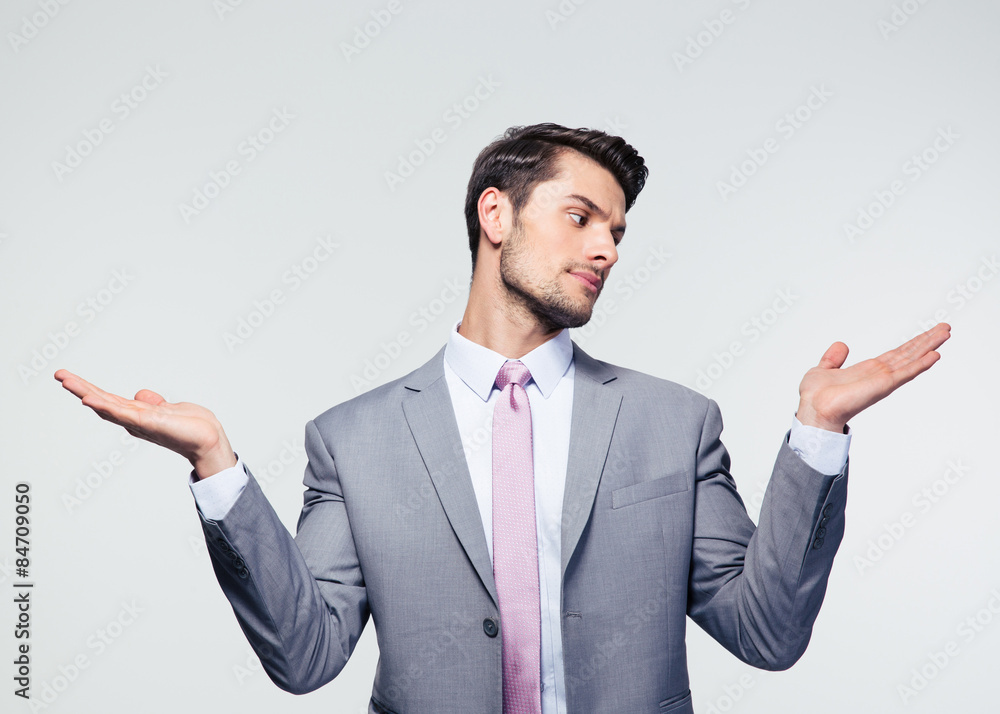 Businessman holding copyspace on the palms Businessman holding copyspace on the palms