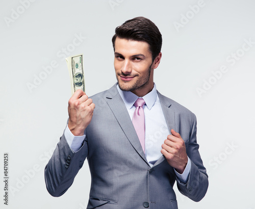 Happy businessman holding us dollars