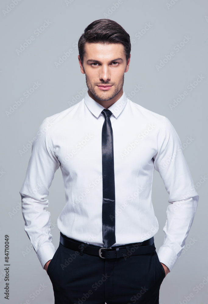 Businessman standing with hands in pocket Businessman standing with hands in pocket