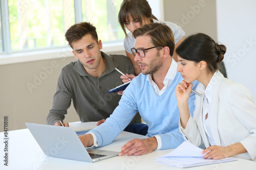 Group of business people working on laptop