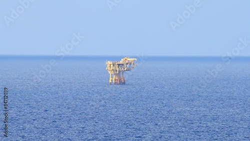 Beautiful sunny day and offshore platform in the middle of the ocean
 photo