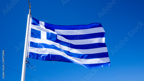 national flag of Greece against blue sky background photo