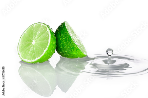 Two slices of lime with water drop