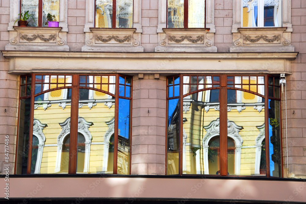 reflections of old building in windows in Lodz reflections of old building in windows in Lodz