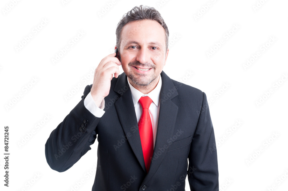 Smiling business man talking on the smartphone Smiling business man talking on the smartphone