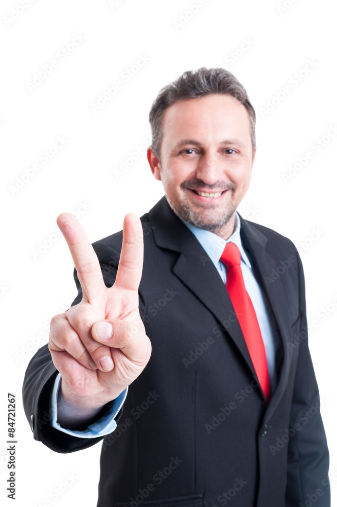 Business man showing victory sign or gesture Business man showing victory sign or gesture