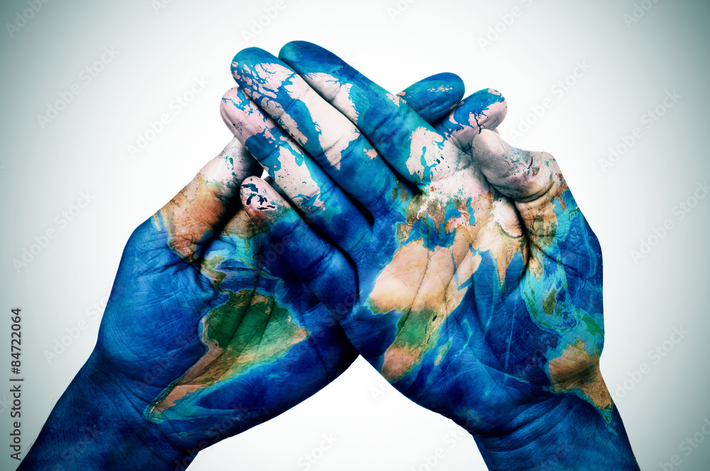 man hands patterned with a world map (furnished by NASA) - obrazy, fototapety, plakaty 