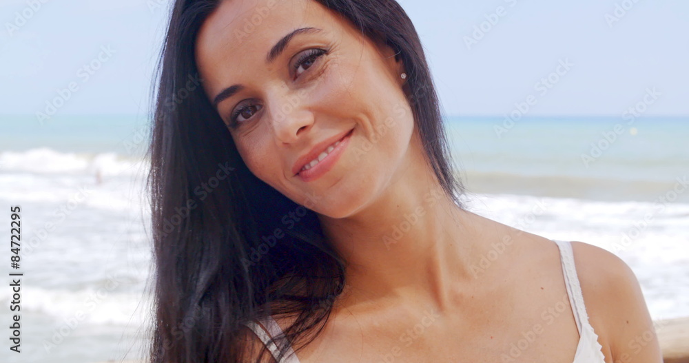 Gorgeous Young Lady at the Beach Smiling at Camera Gorgeous Young Lady at the Beach Smiling at Camera