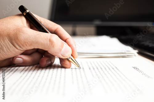 Quadro em tela Person writing on a document