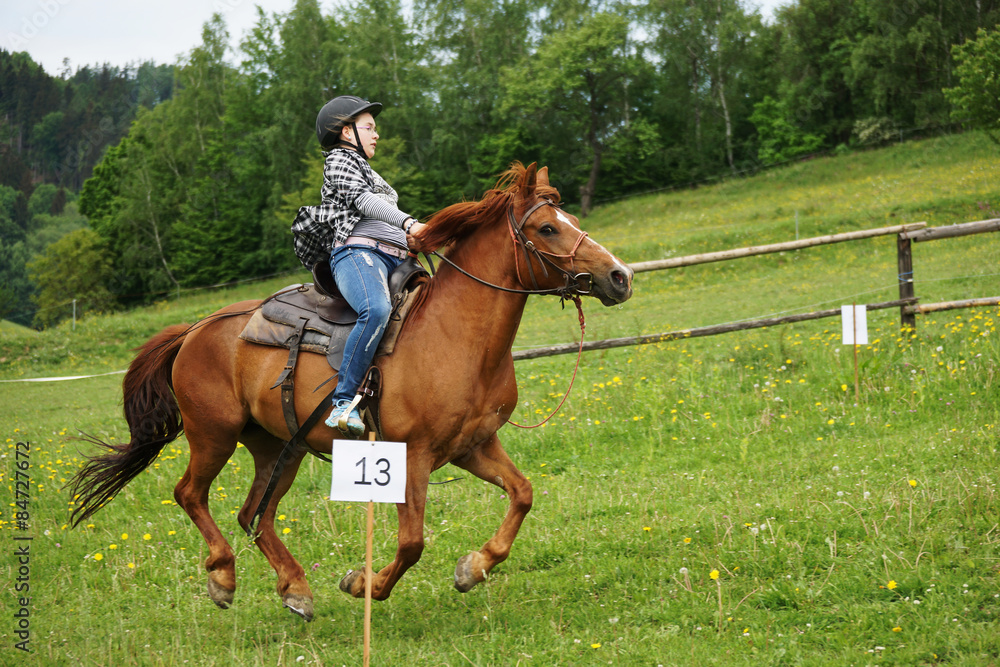 Child riding at races for children