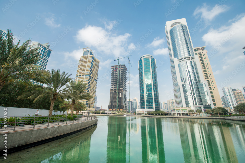 Fototapeta premium Tall skyscrapers in Dubai near water