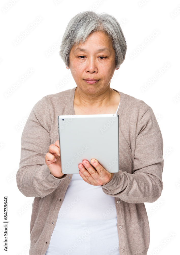 Mature woman use of tablet pc Mature woman use of tablet pc