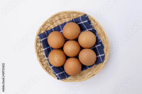 Wallpaper Mural Fresh eggs in the basket on white background Torontodigital.ca