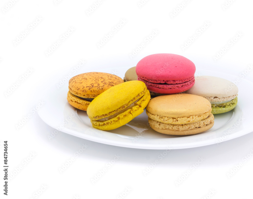 Colorful macarons on white background