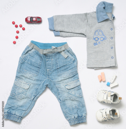top view fashion trendy look of baby boy clothes with toy