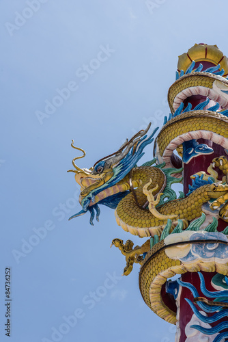 Chinese new year  Dragon statue on pole with blue sky. d