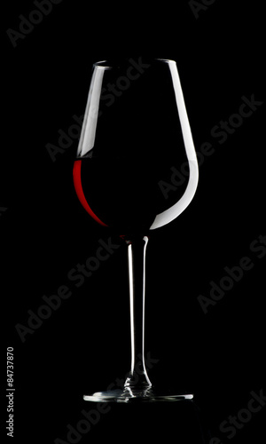 Glass of red wine on dark background
