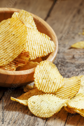 Rippled potato chips in a bowl, selective focus