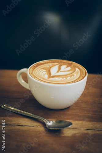 Картината върху платно coffee latte art on the wood desk