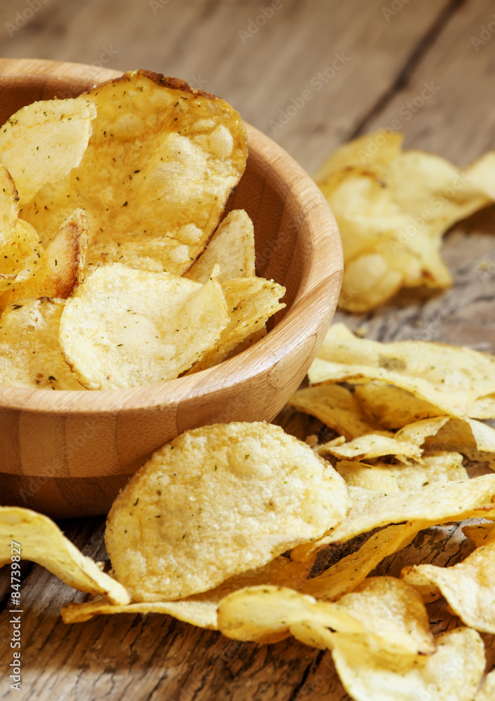 Potato chips in bowl, selective focus Potato chips in bowl, selective focus