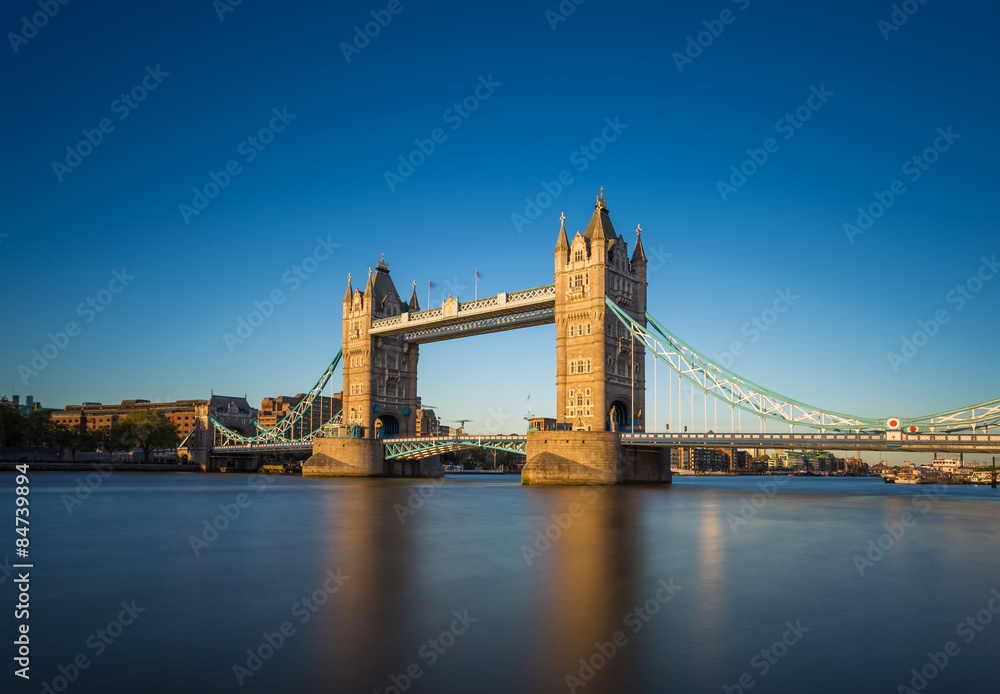 The iconic Tower Bridge at sunset with clear blue sky, London, UK