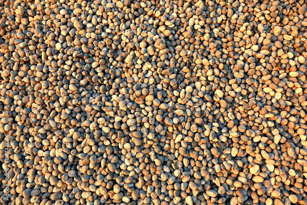 Pebbles on the beach as background