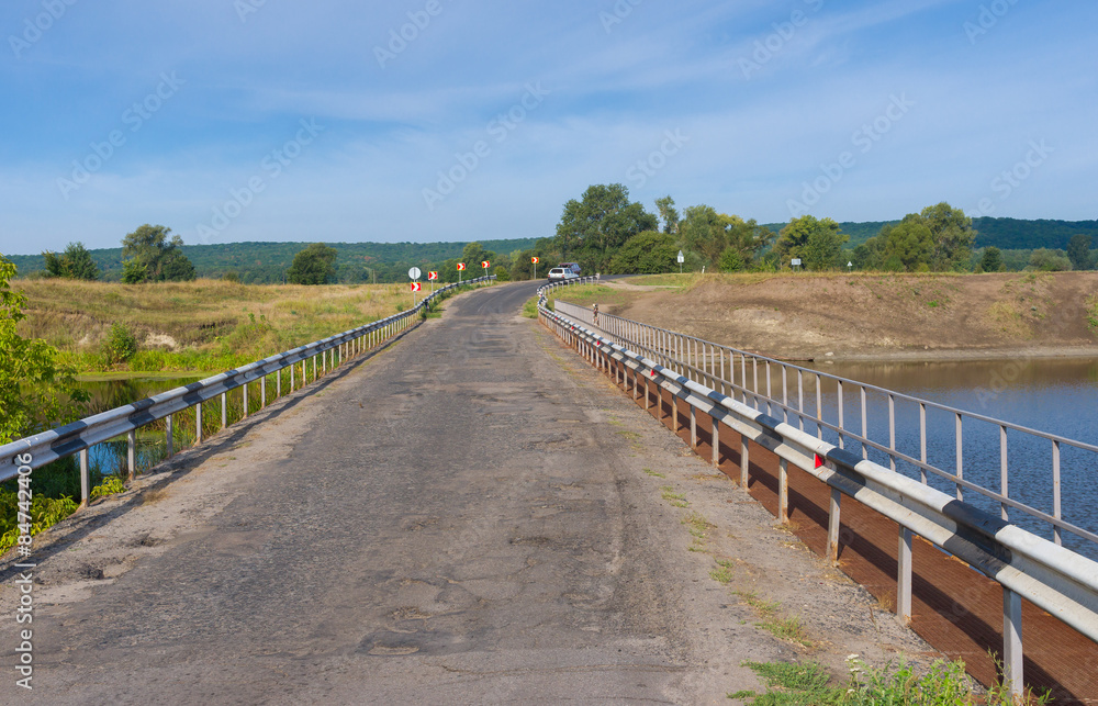 Landscape with old bridge over Vorskla river in, Ukraine