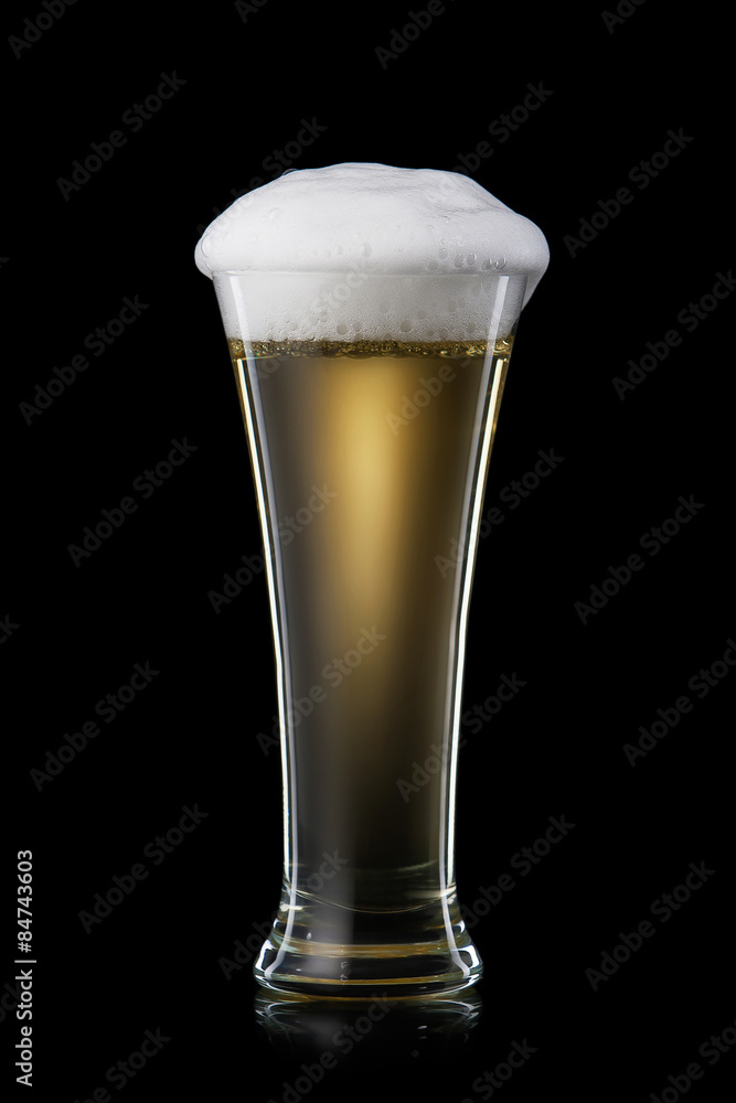 Beer. Beer into glass on black background Beer. Beer into glass on black background