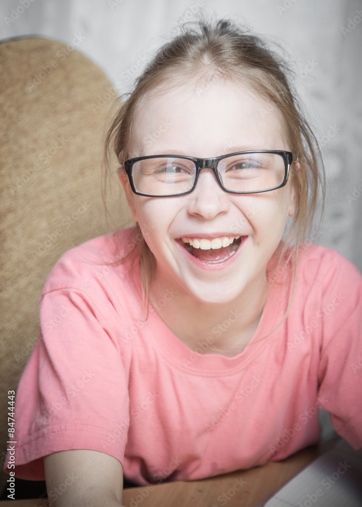 Cute kid girl at home while wearing glasses. Cute kid girl at home while wearing glasses.