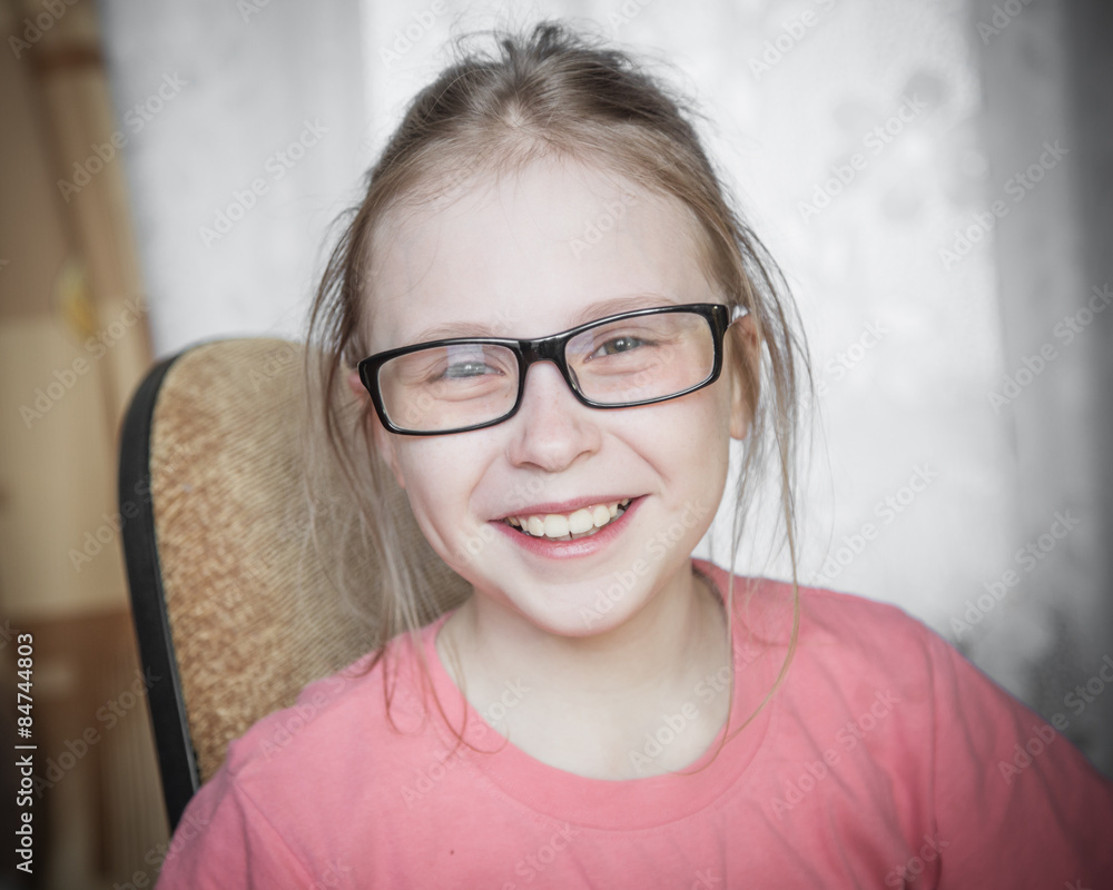 Cute kid girl at home while wearing glasses. Cute kid girl at home while wearing glasses.