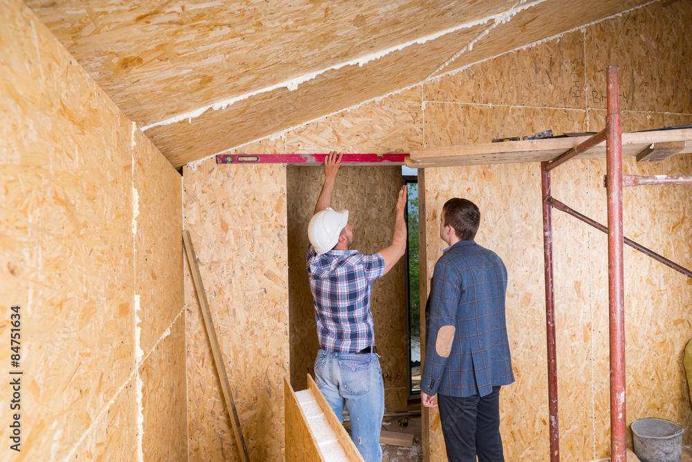 Builder and Architect Inspecting Door Frame Builder and Architect Inspecting Door Frame