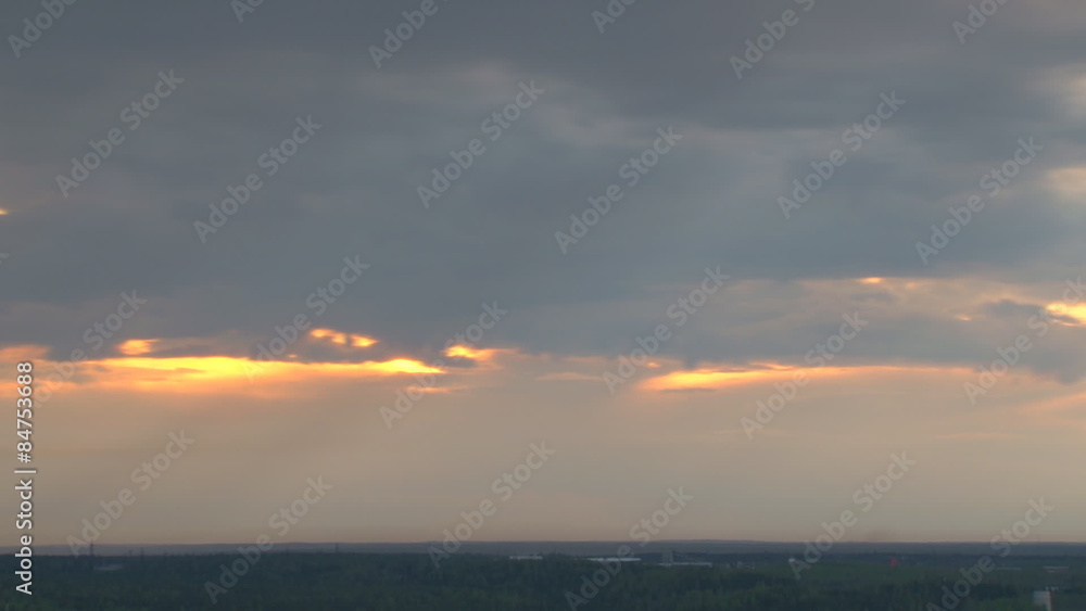Sunset and rain clouds/Rain clouds move quickly over the forest in the evening. It's raining. Time lapse Sunset and rain clouds/Rain clouds move quickly over the forest in the evening. It's raining. Time lapse