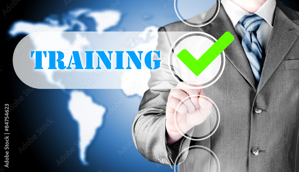 Businessman pressing touch screen interface training checkbox Businessman pressing touch screen interface training checkbox
