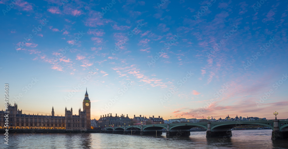 Big Ben and Westminster Bridge and Parliament with colorful clouds at dusk, London, UK
