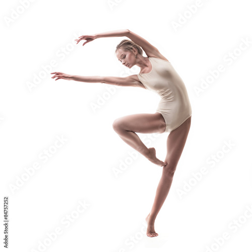 young beautiful dancer in beige swimsuit 